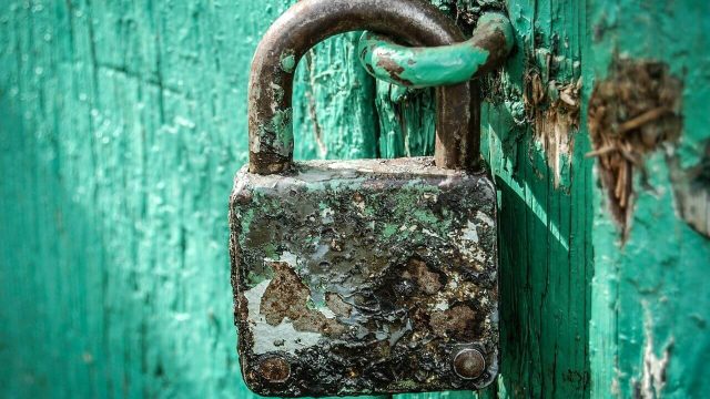 Rusty Padlock On Blue Door ALT